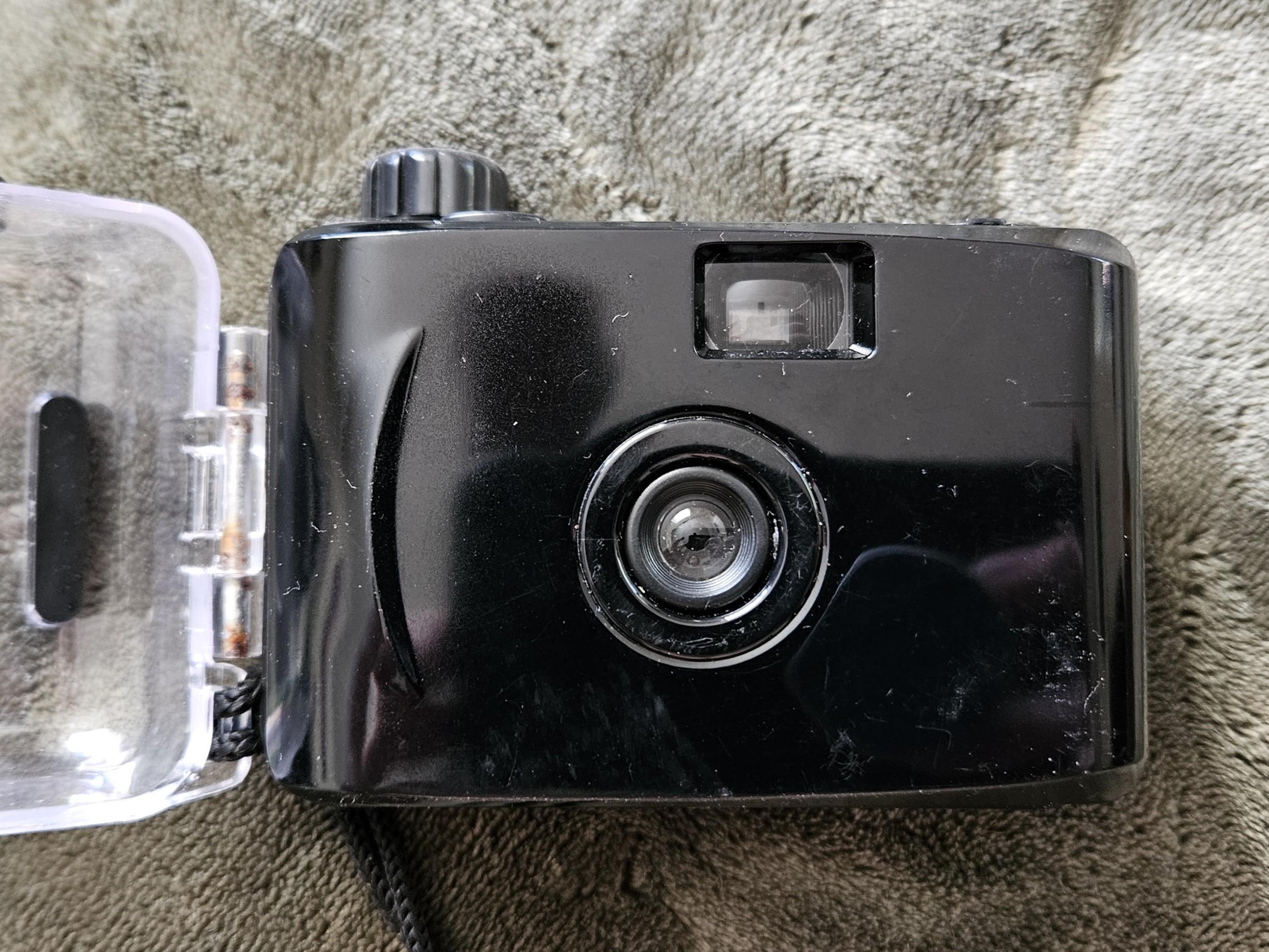 off-brand point and shoot with underwater case (camera)