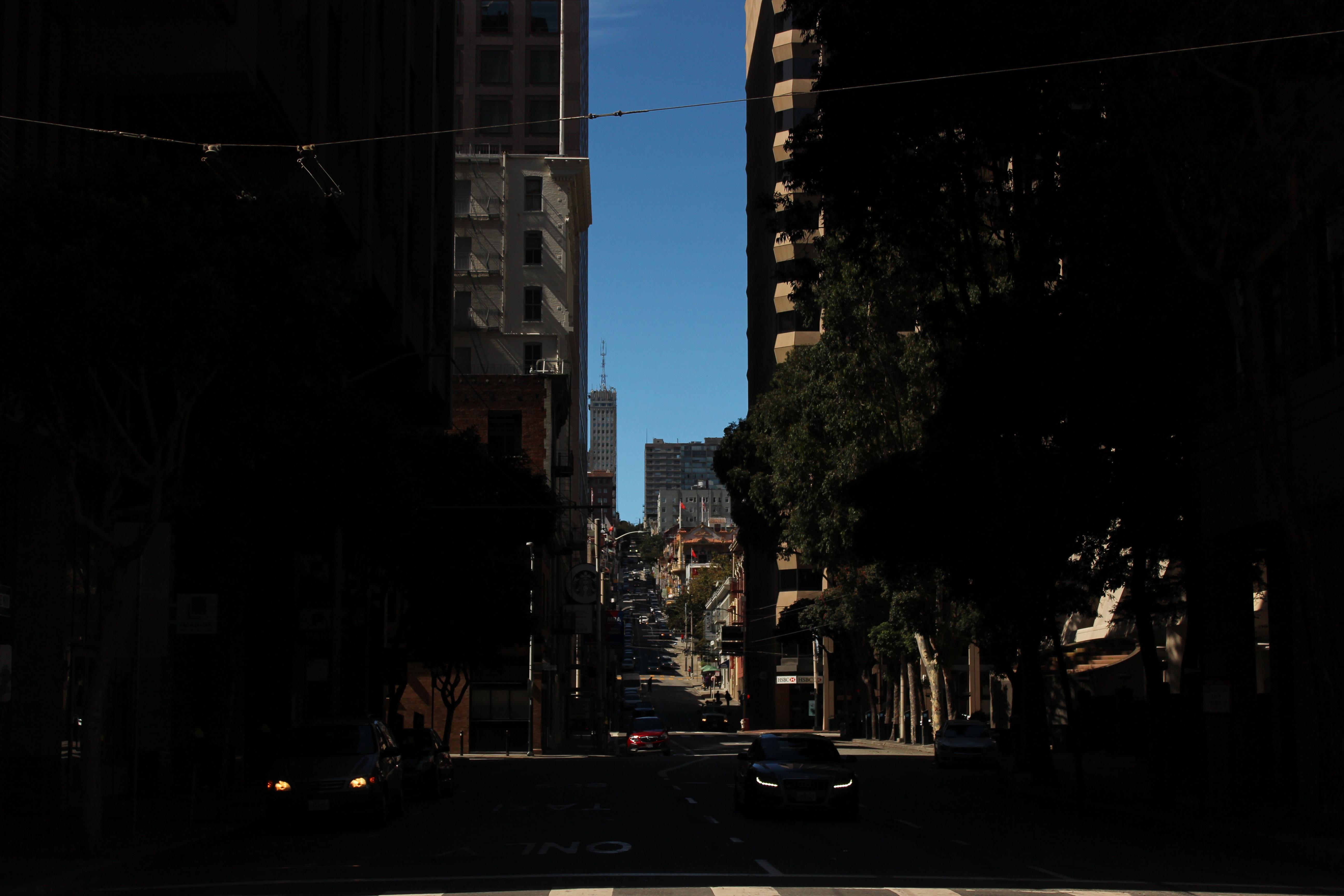 a street view of a district of a city of skyscrapers