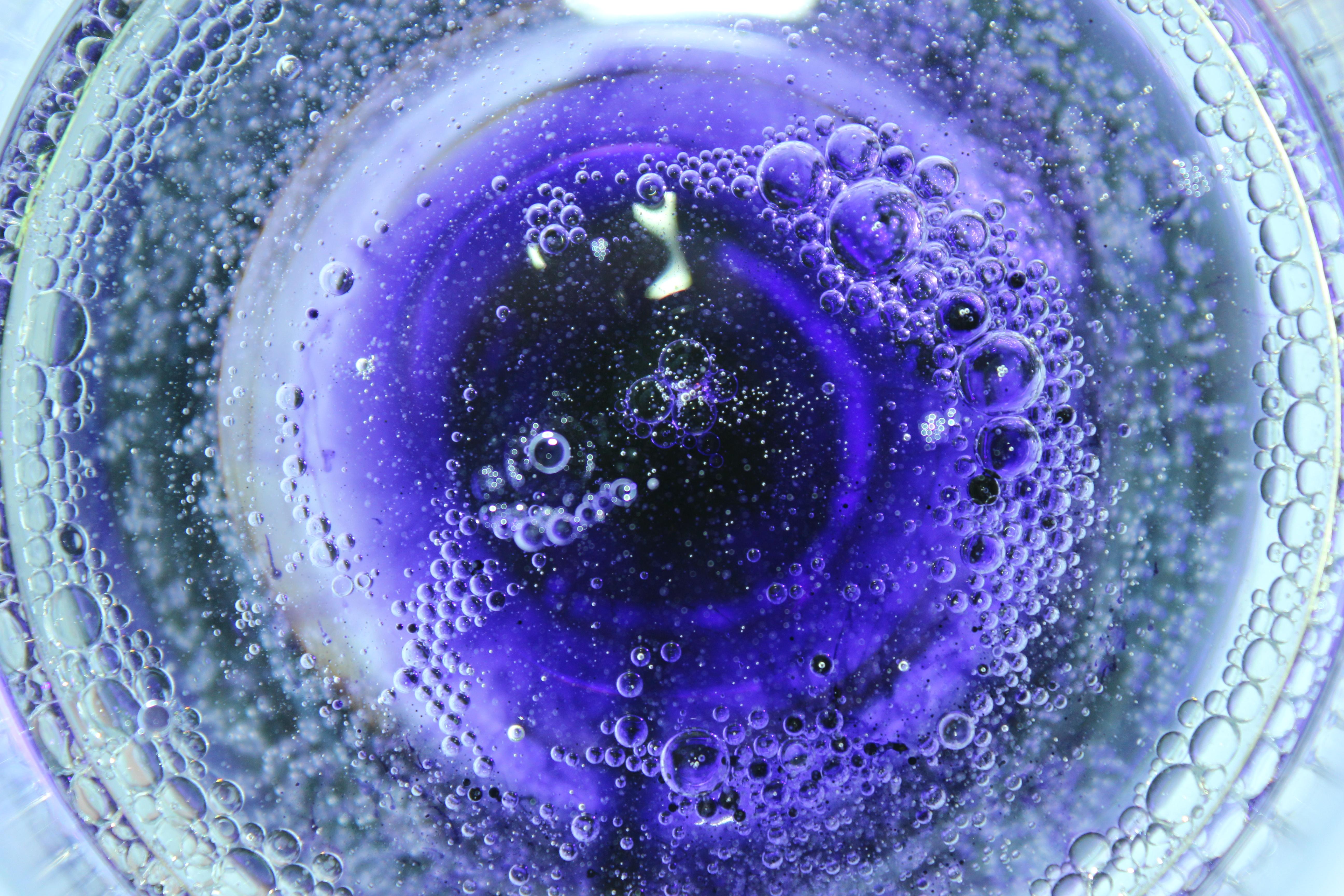 bubbling purple liquid seen from above