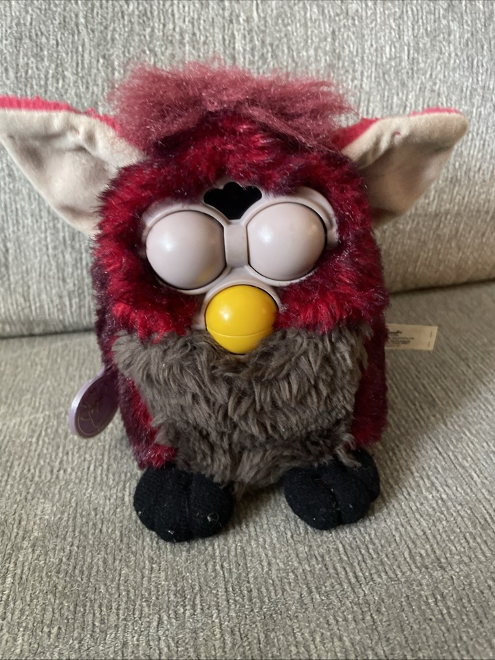 a furby with no paint on its eyes