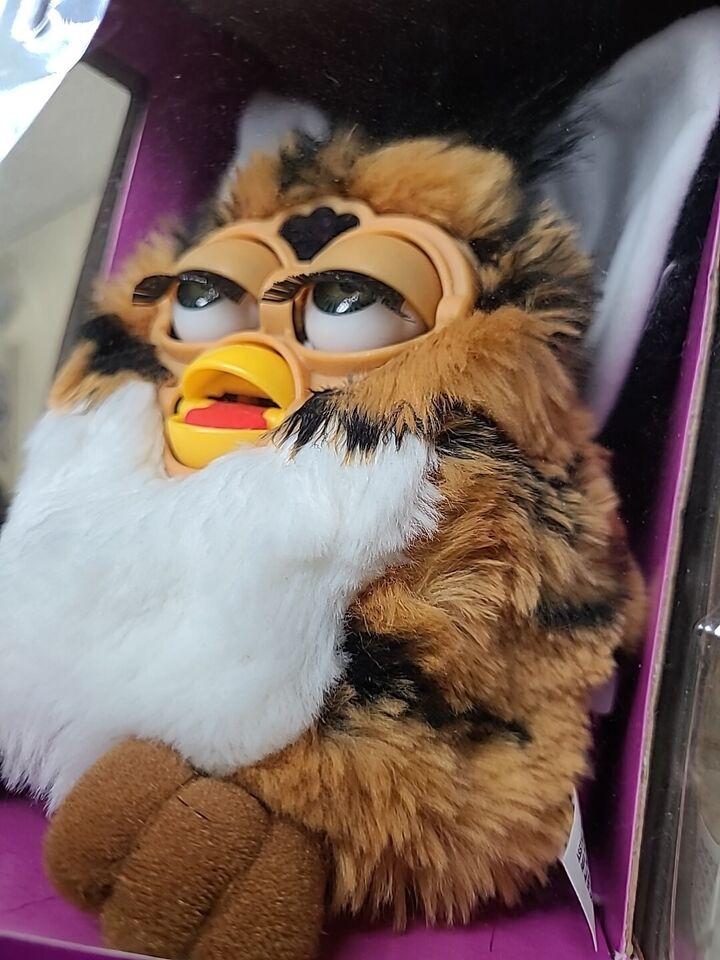 a high-looking furby in a box